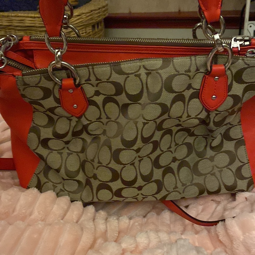 NWOT Authentic Coach crossbody bag. Red and brown. Pristine condition. Not used.
